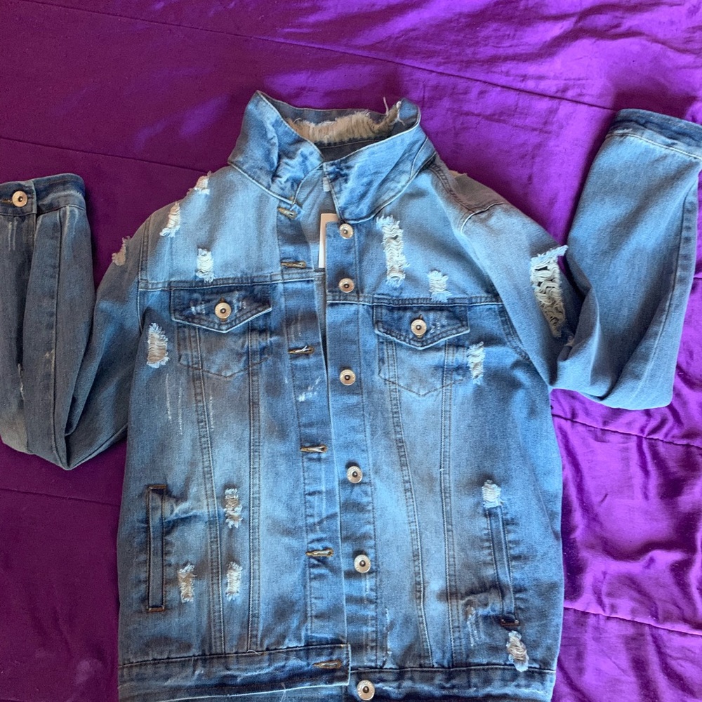 Distressed denim jacket.
